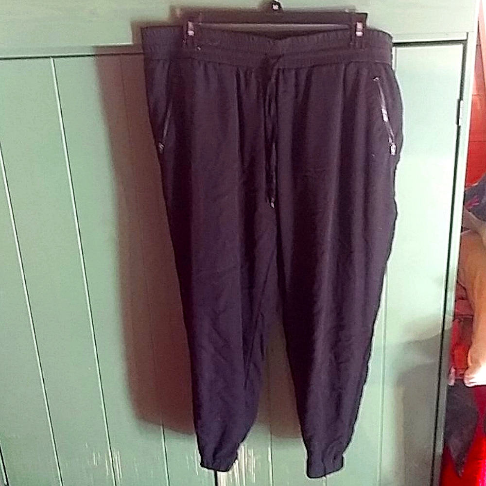 Black rayon trousers, elastic waist & ankles.